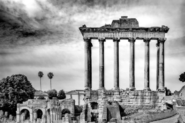 The Temple of Saturn was an ancient Roman temple to the god Saturn. Its ruins stand at the foot of the Capitoline Hill at the western end of the Roman Forum. The original dedication of the temple is traditionally dated to 497 BC.